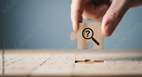 Hand holding puzzle piece with magnifying glass and question mark symbolizing search