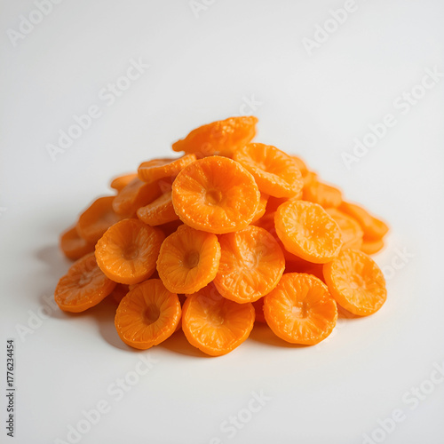 Vibrant Pile of Dried Apricots on White Background Highlighting Texture and Natural Freshness