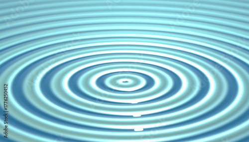 Concentric circles expanding on surface of blue water