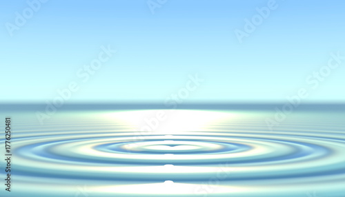 Concentric water ripples expanding on a calm blue surface under a clear sky