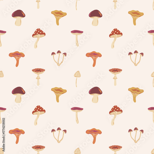 Vector seamless fall pattern with scattered hand drawn forest mushrooms in warm colors on cream background. Rustic woodland and autumn nature design for textile, wrapping paper, notebook cover