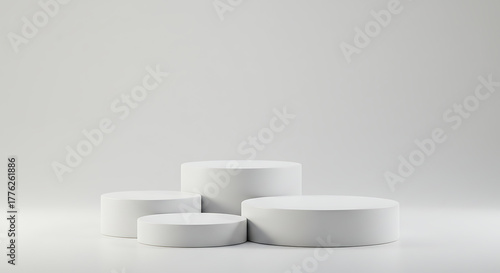 Four white round podiums isolated on white background for product display, a minimal, modern display platform (dais/pedestal) for product or presentation visuals