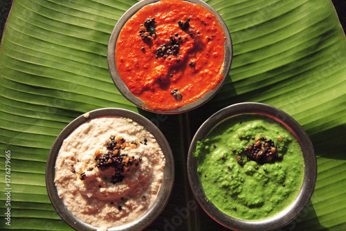 indian food chutneys on banana leaf