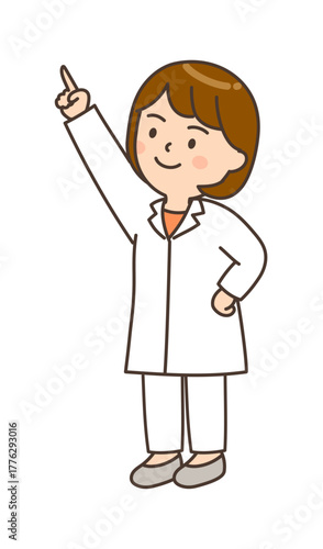 腰に手を当てて斜め上を指さす若い笑顔の女性医師