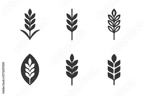 Wheat Field Logos. A field of golden wheat swaying in the breeze. Set Logo of a field of golden wheat swaying in the breeze: single wheat ear emblem. Icon set.