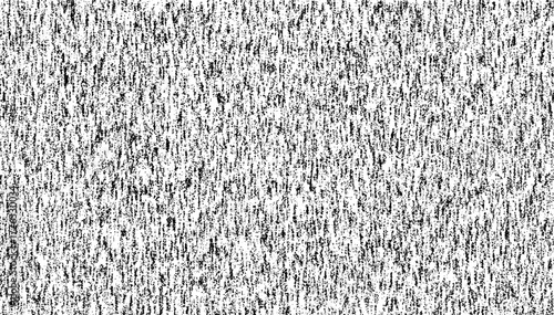 Grunge halftone gradient background featuring a faded grit noise texture. A black and white sand-style surface texture. 