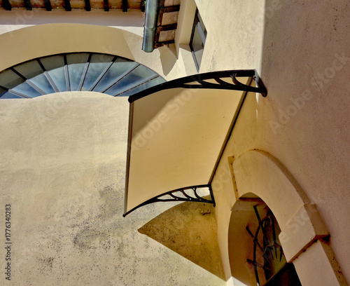 architectural forms that intertwine in a village between light walls