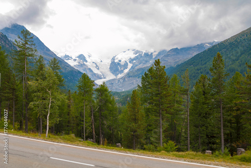 View of Morteratsch Glacier from the Bernina Express, with icy blue formations, rugged alpine peaks, and stunning panoramic landscapes along the scenic train route
