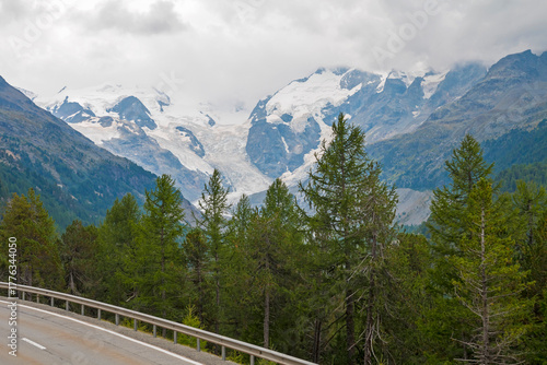 View of Morteratsch Glacier from the Bernina Express, with icy blue formations, rugged alpine peaks, and stunning panoramic landscapes along the scenic train route
