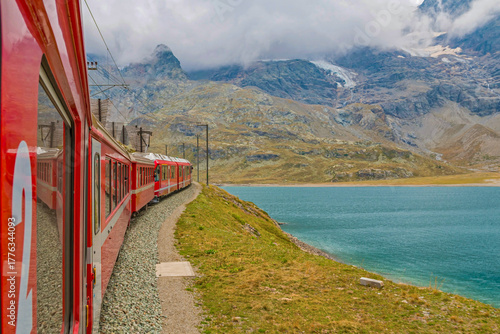 Bernina Express glides from Tirano to St. Moritz, treating passengers to panoramic alpine landscapes and charming villages. Stunning views make this one of the most scenic train journeys in the world