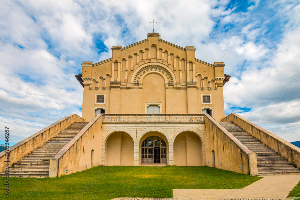 Fototapeta premium Santuario Madonna di Montecastello, Italy, perched on a hilltop, offering panoramic views of the surrounding valleys, historic architecture, and a serene, spiritual atmosphere