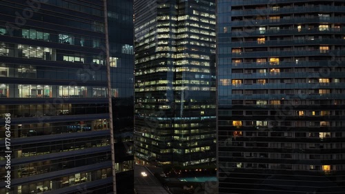 twilight time illuminated singapore city downtown office buildings front aerial panorama 4k 