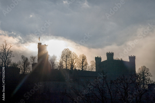 Silhouette of castle against sunset