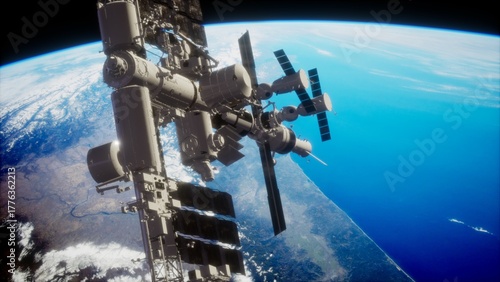 Fototapeta Naklejka Na Ścianę i Meble -  In a stunning view from above, the international space station travels gracefully around Earth, showcasing its solar panels and various modules against a backdrop of deep blue ocean and clouds.