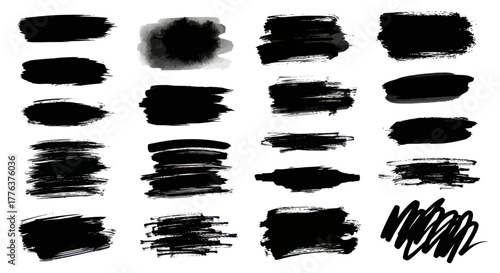 Collection of black brush strokes and ink splatters on a white background.