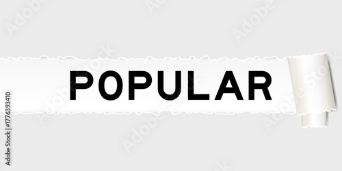 Ripped gray paper background that have word popular under torn part