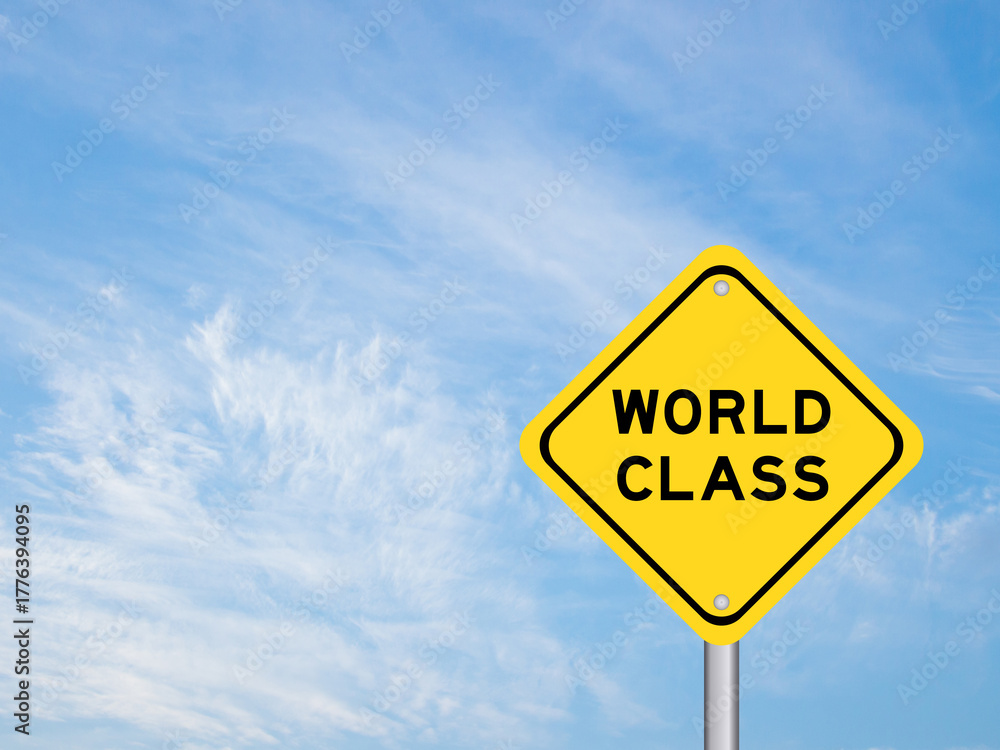 Fototapeta premium Yellow transportation sign with word world class on blue color sky background