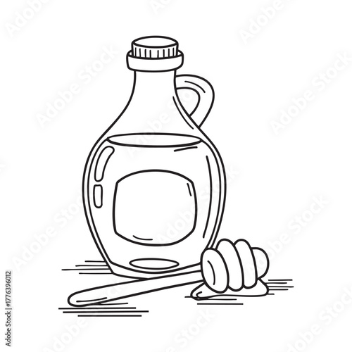 Bottle of dark date syrup with wooden dipper