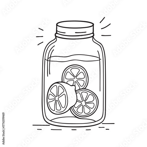 Glass jar packed with preserved lemons submerged in brine