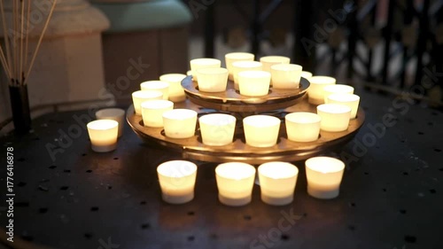Burning candles in a church interior