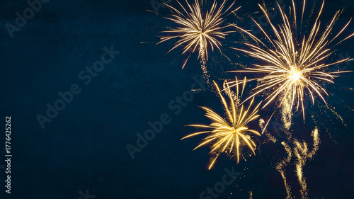 Silvester, New Year's Eve, Festival Party New Year 2026, new years eve Fireworks background banner panorama - firework and sparklers on rustic dark blue night sky texture