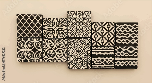 Collection of decorative patterned tiles in black and white, creating a visually striking mosaic.
