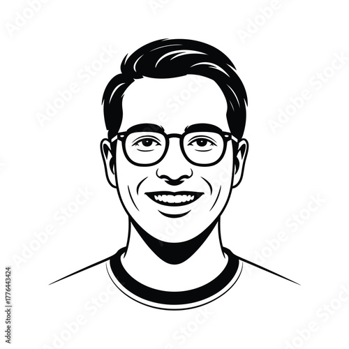 A smiling young man with glasses poses for a portrait.