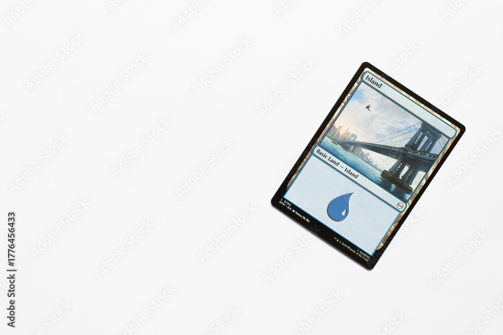 Naklejka premium Bradford, UK Nov 3 2025 Basic Land Island Spider-man card magic the gathering card shot isolated on a white paper background.