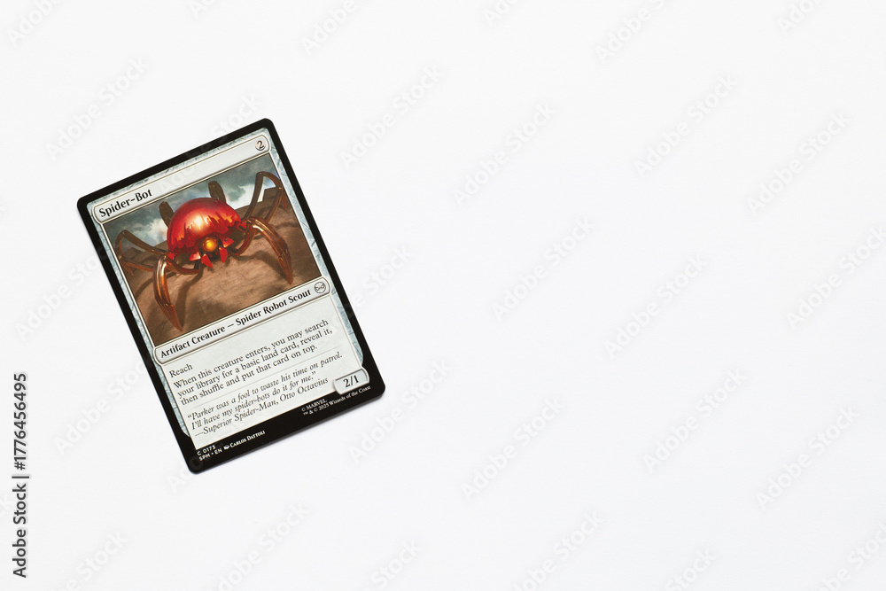 Obraz premium Bradford, UK Nov 3 2025 Spider-Bot Artifact Creature card from the Spider-man magic the gathering card game shot isolated on a white paper background.