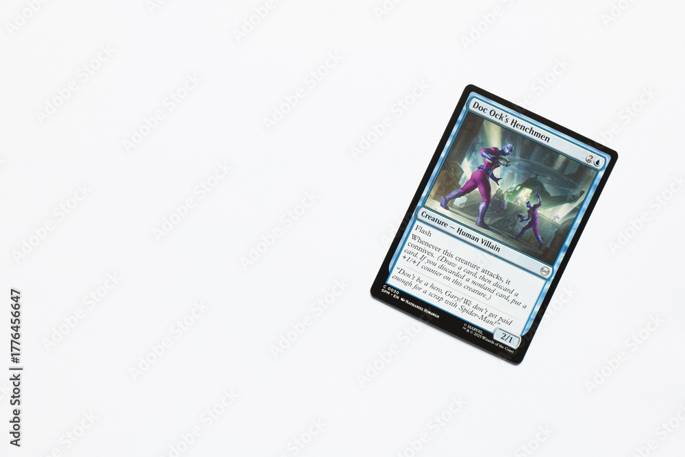 Obraz premium Bradford, UK Nov 3 2025 Doc Ock's Henchmen magic the gathering card shot isolated on a white paper background.