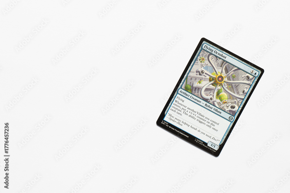 Obraz premium Bradford, UK Nov 3 2025 Flying Octobot card from the Spider-man magic the gathering card game shot isolated on a white paper background.