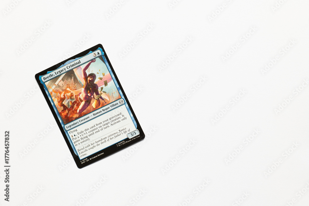 Obraz premium Bradford, UK Nov 3 2025 Beetle, Legacy Criminal card from Spider-man magic the gathering card game shot isolated on a white paper background.