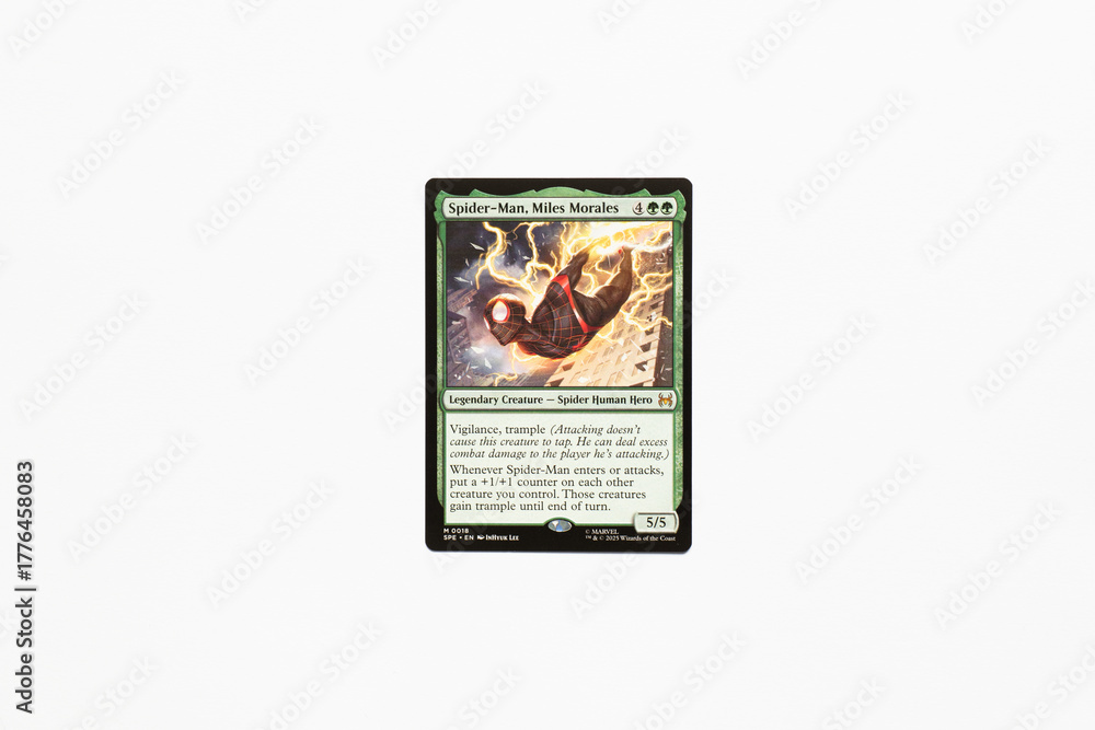 Naklejka premium Bradford, UK Nov 3 2025 Spider-man, Miles Morales card from the Spider-man magic the gathering card game shot isolated on a white paper background.