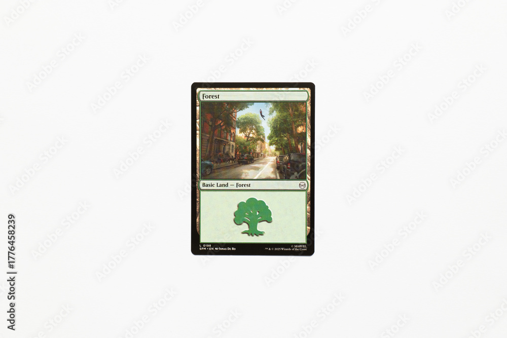 Obraz premium Bradford, UK Nov 3 2025 Forest basic land card from Spider-man magic the gathering game shot isolated on a white paper background.