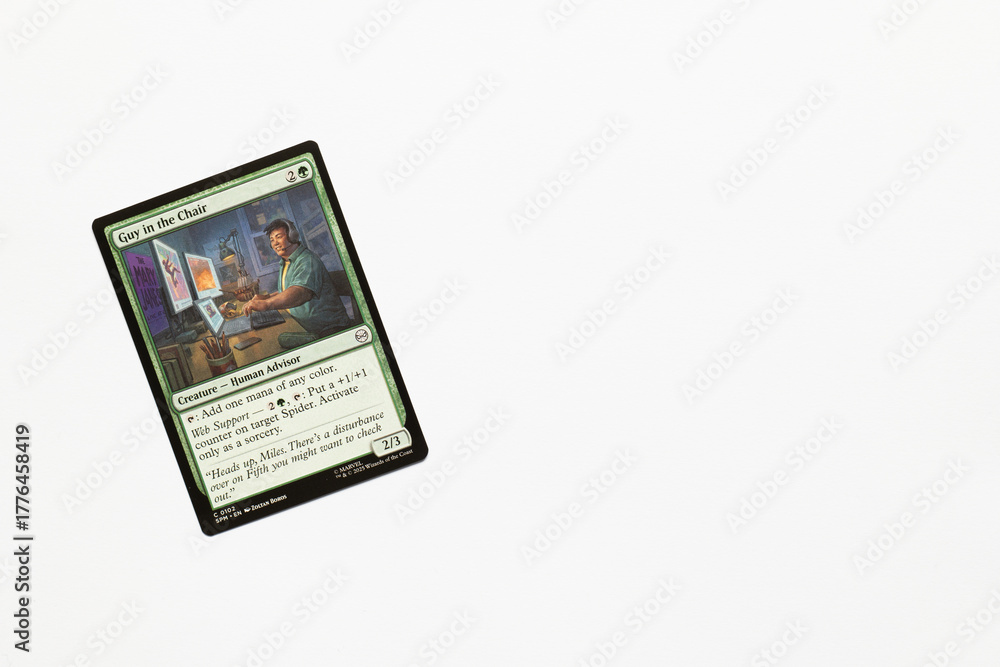 Obraz premium Bradford, UK Nov 3 2025 Guy in the Chair card from Spider-man magic the gathering card game shot isolated on a white paper background.