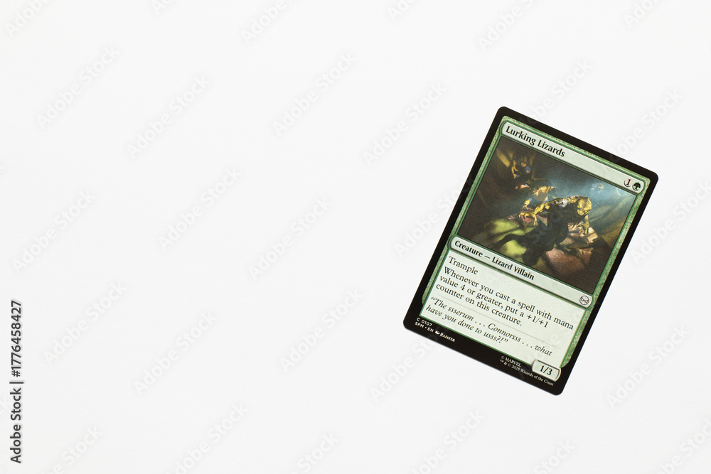 Obraz premium Bradford, UK Nov 3 2025 Lurking Lizards card from Spider-man magic the gathering card game shot isolated on a white paper background.