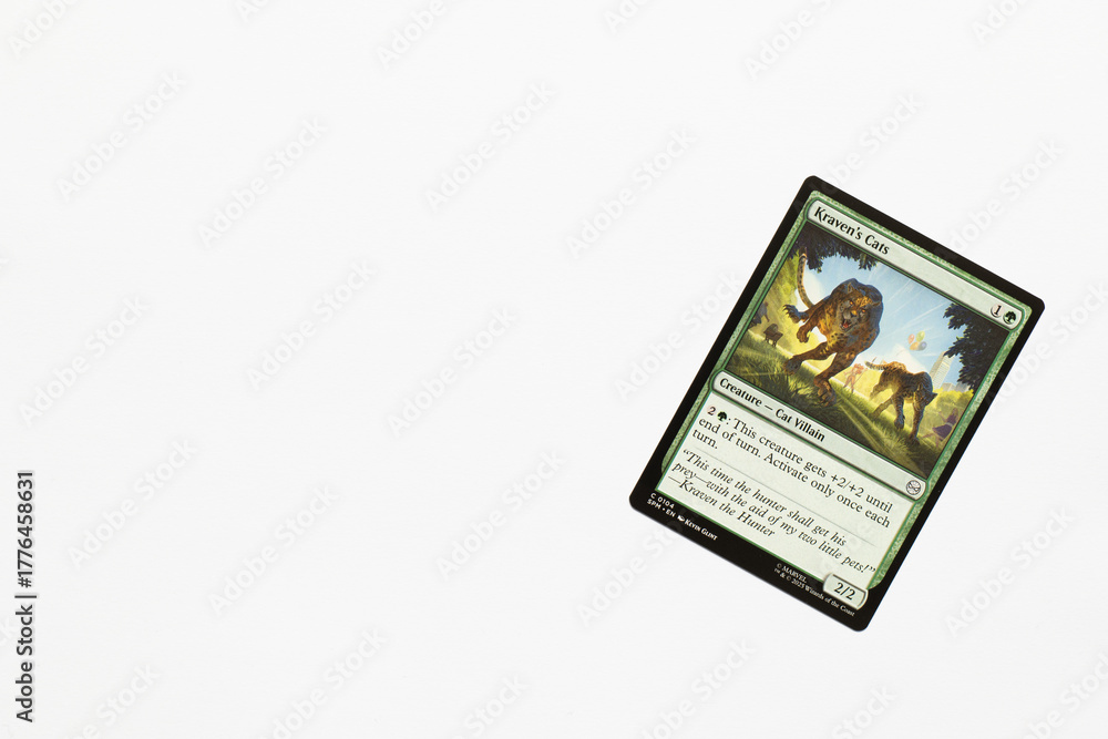 Naklejka premium Bradford, UK Nov 3 2025 Kraven's Cats card from Spider-man magic the gathering card game shot isolated on a white paper background.