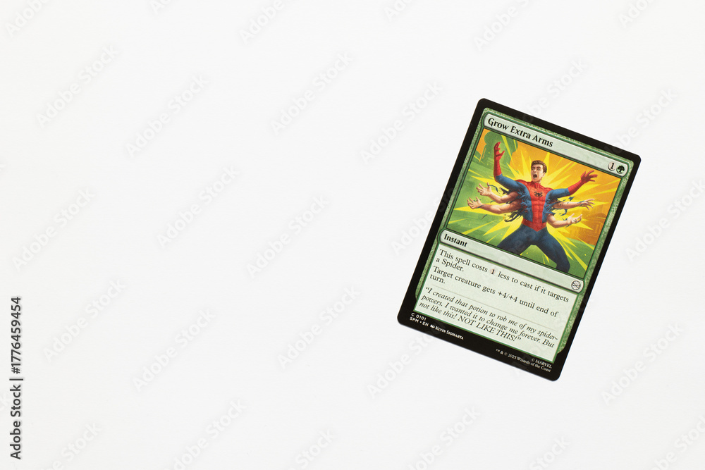 Obraz premium Bradford, UK Nov 3 2025 Grow Extra Arms card from Spider-man magic the gathering shot isolated on a white paper background.