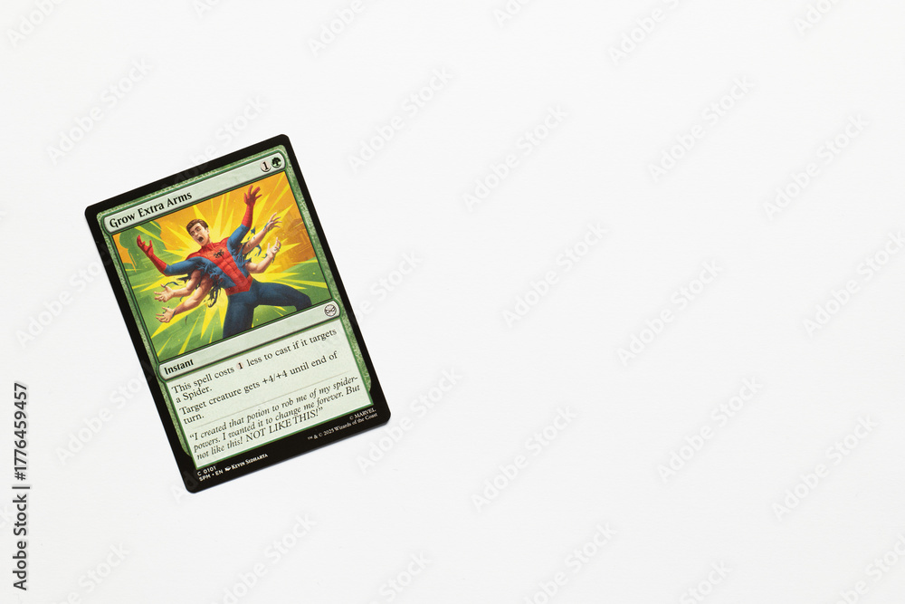 Naklejka premium Bradford, UK Nov 3 2025 Grow Extra Arms card from Spider-man magic the gathering shot isolated on a white paper background.