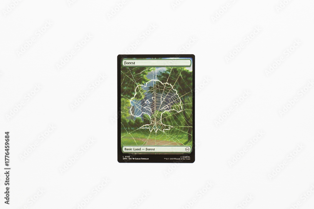 Obraz premium Bradford, UK Nov 3 2025 Forest, basic land card from Spider-man magic the gathering card game shot isolated on a white paper background.
