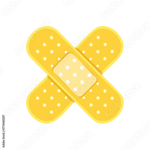Cross shape yellow adhesive bandage with polka dots for wound care and medical treatment