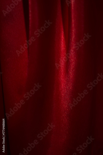 Close-up photo of a luxurious red satin background. Beautiful colors convey (blur or berry).