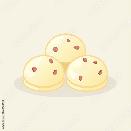 Three Cream Puffs with Red Speckles on a Light Cream Colored Background with Subtle Shadowing