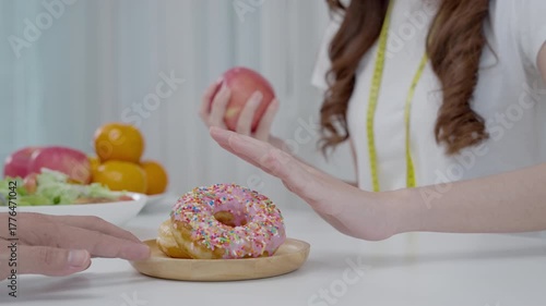 slim body asian women choose confuse donut, dieting female choose method for diet. Good healthy food. weight lose, balance, control, reduce fat, low calories, routines, exercise, body shape.