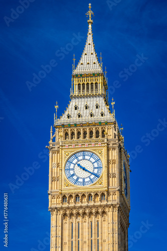 Close-up of Big Ben clock face under bright sunlight in London on a sunny day
