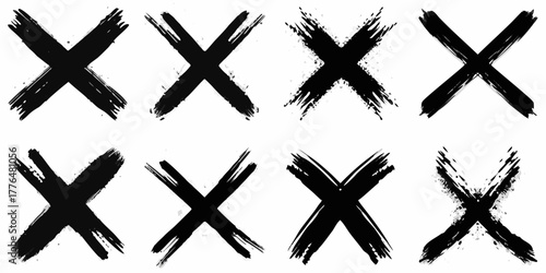Collection of eight diverse black ink brush stroke x marks on a white background
