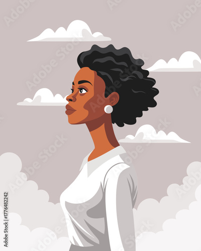Young African American woman with curly hair. A strong woman looking up at the sky. Freedom, feminism, female dignity concept.