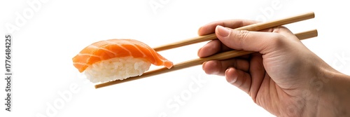 Salmon sushi nigiri gripped by chopsticks isolated on white background