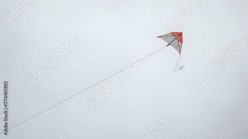 perigee. Broken kite string, kite drifting away in gray overcast sky, minimalist composition. wellbeing guides, coaching materials, designed for mental health education and mindfulness programs.