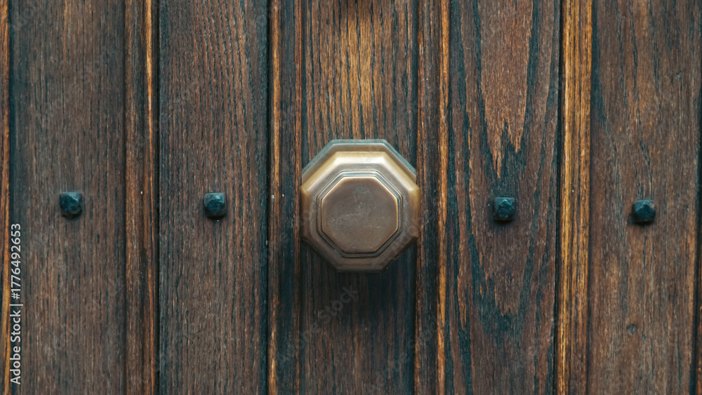 Fototapeta premium Old wooden door handle closeup showing rustic charm and antique craftsmanship